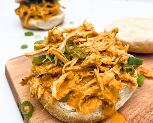 Buffalo ranch shredded chicken piled on a bun.