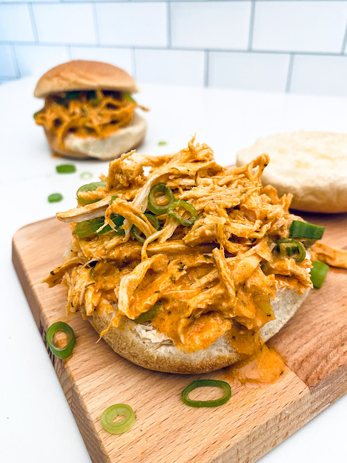 Buffalo ranch shredded chicken piled on a bun.