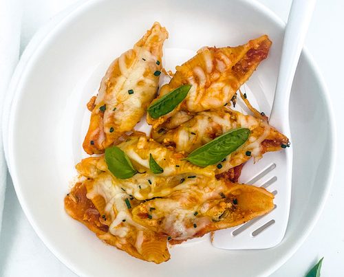 No boil vegetarian stuffed shells in a white bowl.
