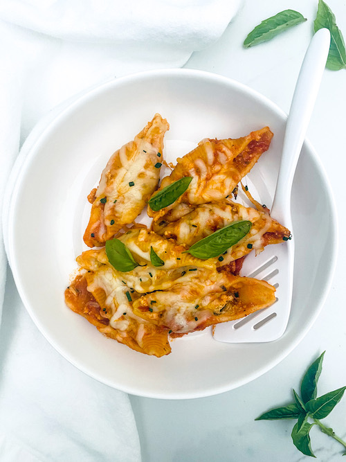No boil vegetarian stuffed shells in a white bowl.
