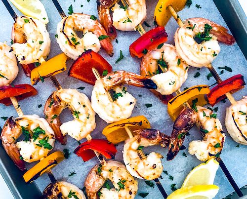 Shrimp Kebabs on a parchment lined baking sheet.