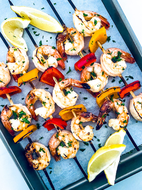 Shrimp Kebabs on a parchment lined baking sheet.