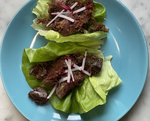 Pork and mushroom carnitas in lettuce wraps.