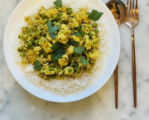 Thai Chicken and Pea Stir Fry in a white bowl.