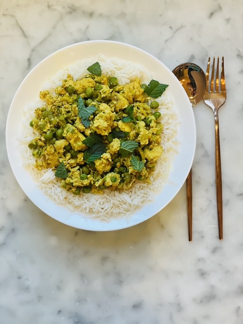 Thai Chicken and Pea Stir Fry in a white bowl.