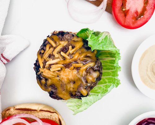 Cheddar burgers and lettuce with all the toppings.