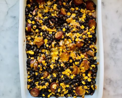 Black bean chorizo bake in a white baking dish.