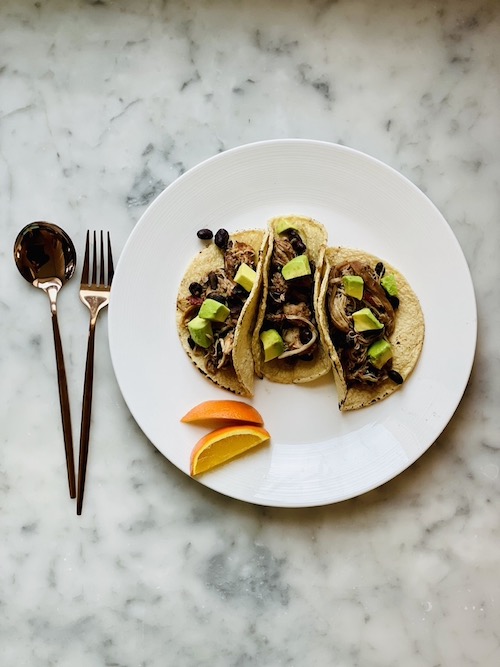 Chipotle orange chicken and beans in corn tortillas.