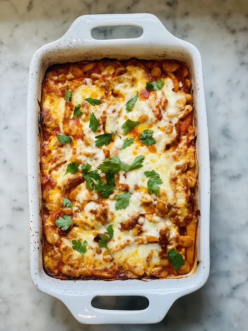 A white casserole dish of pizza bean bake.