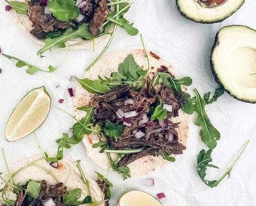 Garlic lime beef and arugula on corn tortillas.