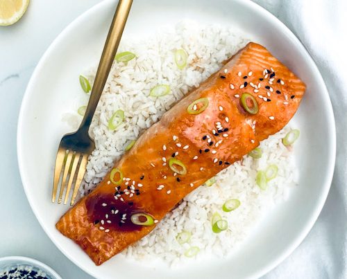 Sweet-spicy glazed salmon on white rice.