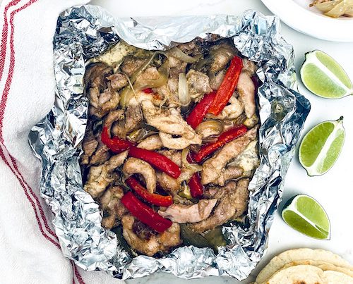 Chicken fajita filling in a foil packet.