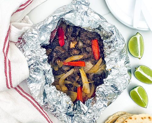 Steak fajita filling in a foil packet.