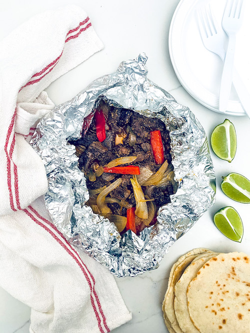 Steak fajita filling in a foil packet.