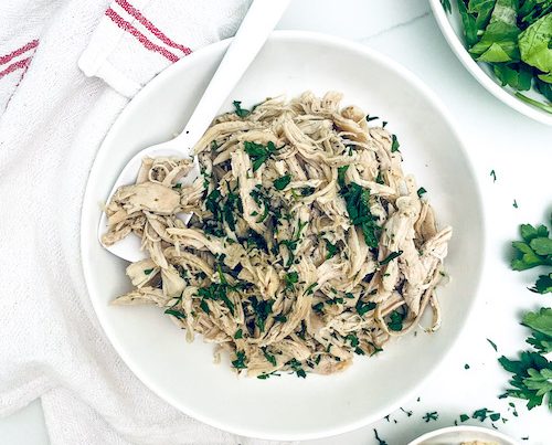 Italian shredded chicken topped with fresh parsley.