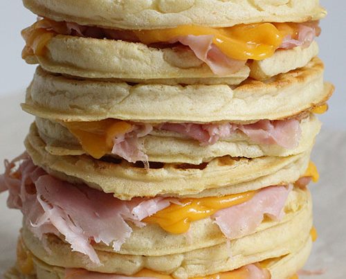 A stack of ham and cheese waffle sandwiches.
