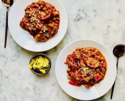 Baked beans with pork set in two bowls.