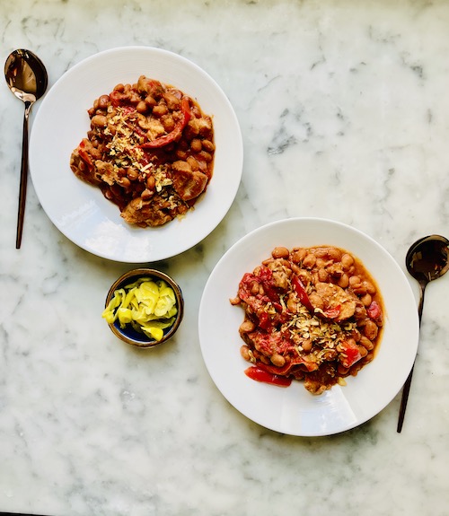 Baked beans with pork set in two bowls.