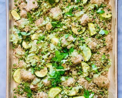 Green goddess chicken and rice on a baking sheet.