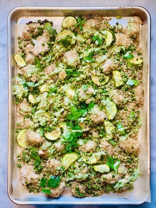 Green goddess chicken and rice on a baking sheet.
