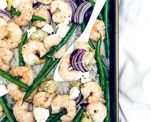 Shrimp and green beans on a sheet pan.