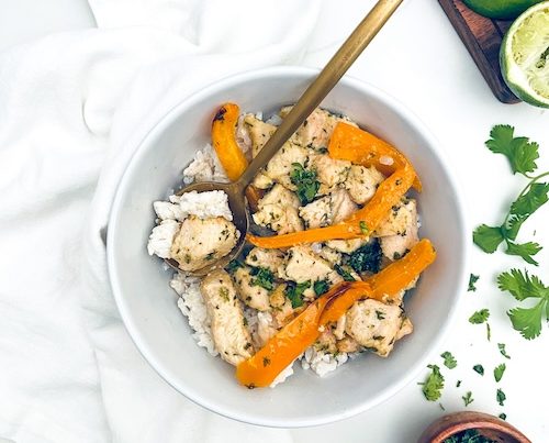 Chicken and bell peppers served over rice.