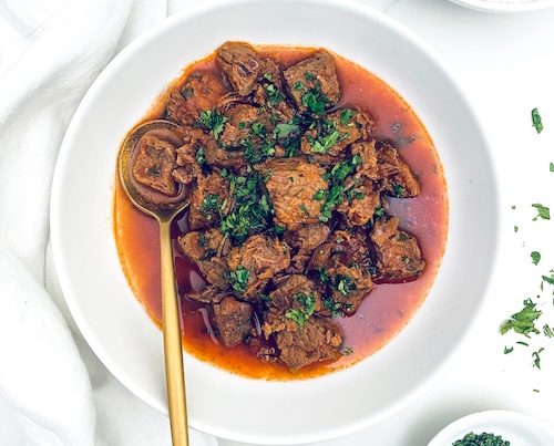 Puerto Rican Beef Stew in a white bowl.
