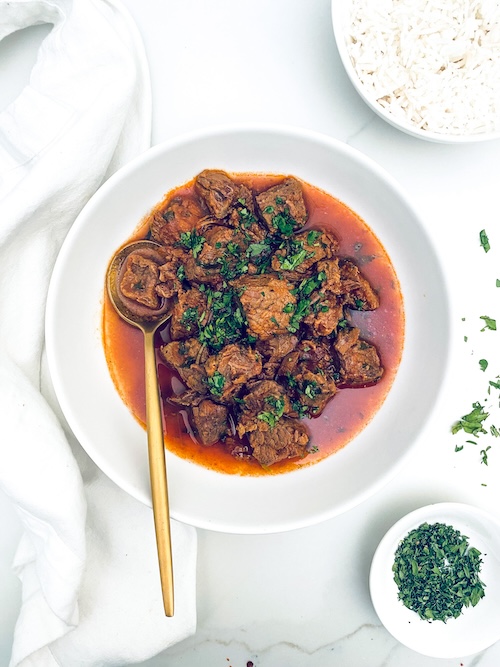 Puerto Rican Beef Stew in a white bowl.