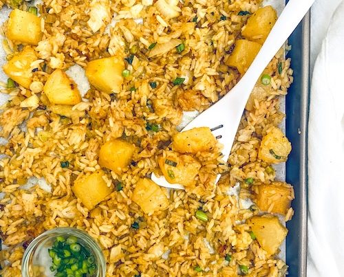 A sheet pan of vegetarian pineapple fried rice.