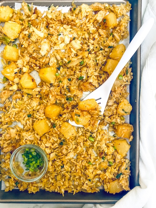 A sheet pan of vegetarian pineapple fried rice.