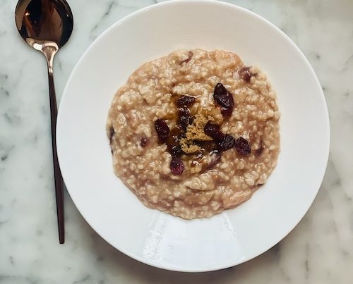 A bowl of dried cranberry oatmeal.