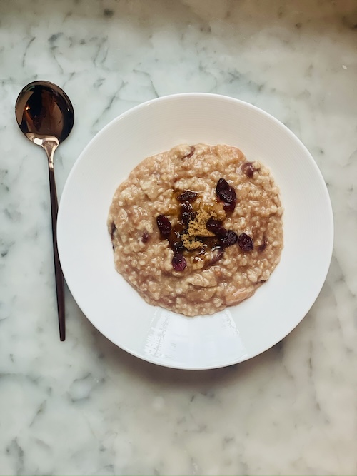 A bowl of dried cranberry oatmeal.