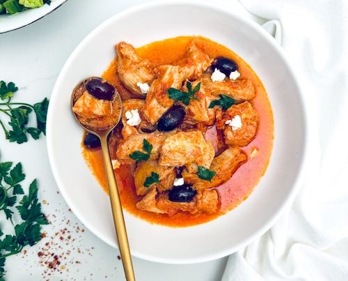 Feta and olive chicken in a bowl.