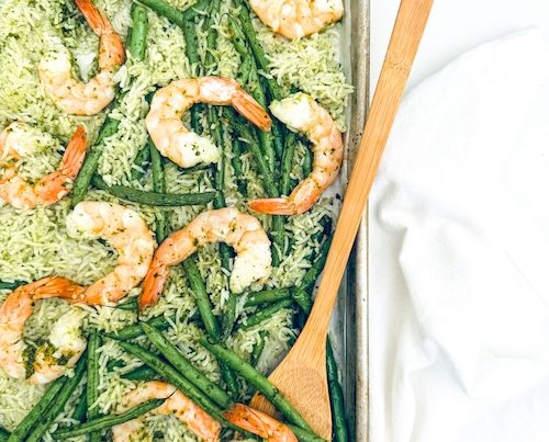 Shrimp, green beans, and rice on a sheet pan.