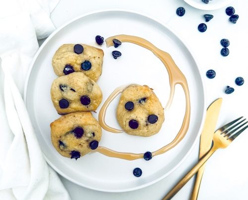 Mini chocolate chip pancake bites on a plate.