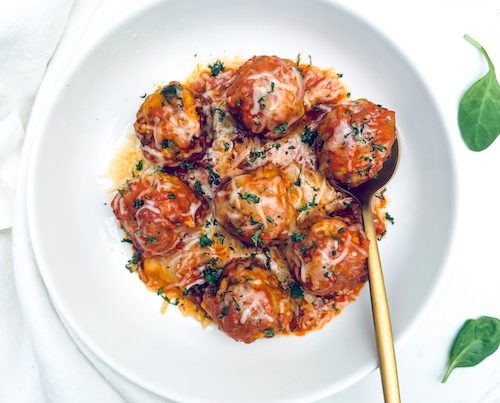 Turkey meatballs in sauce in a bowl.