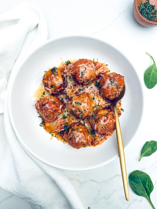 Turkey meatballs in sauce in a bowl.