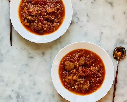 Two bowls of sausage tomato soup.