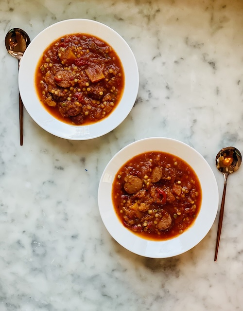 Two bowls of sausage tomato soup.