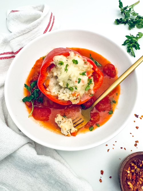 Chicken cheesy stuffed pepper in a bowl.