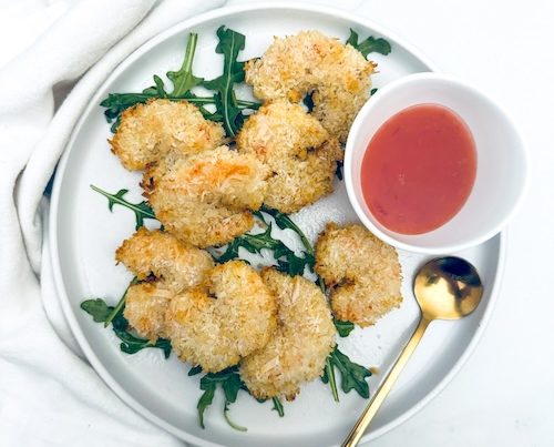 Coconut breaded shrimp on a plate.