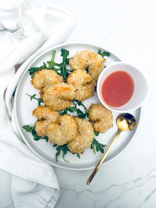 Coconut breaded shrimp on a plate.