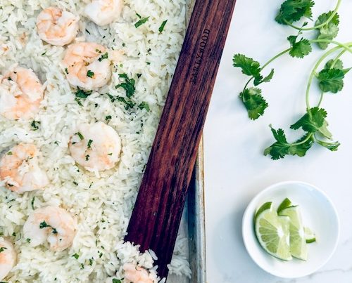 Garlic butter shrimp and rice on a sheet pan.