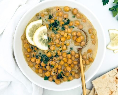 Chickpeas and cheese in a bowl.