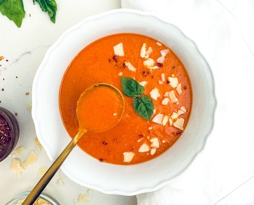 A bowl of roasted red pepper and lentil soup.