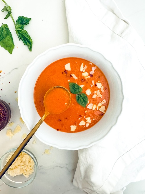 A bowl of roasted red pepper and lentil soup.