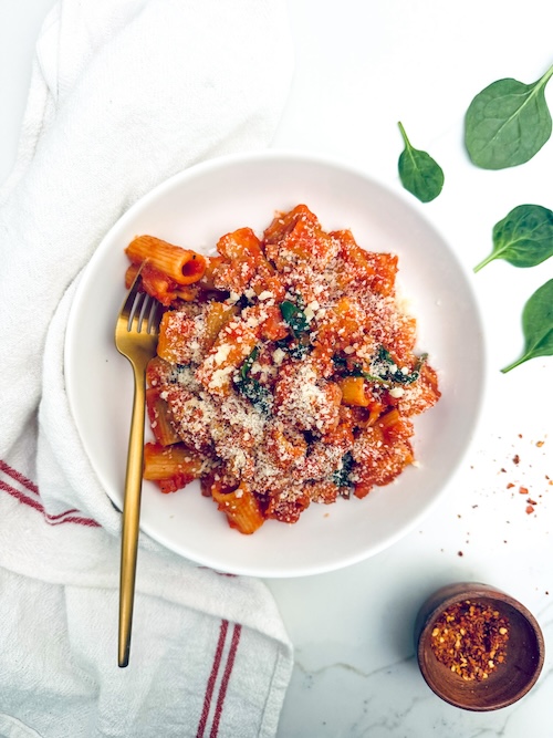Sausage pasta marinara in a bowl.