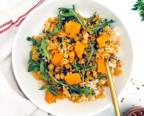 Butternut squash, chickpeas, and rice in a bowl.