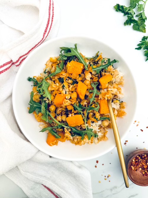 Butternut squash, chickpeas, and rice in a bowl.