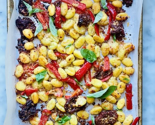 Sheet pan of roasted peppers and gnocchi.